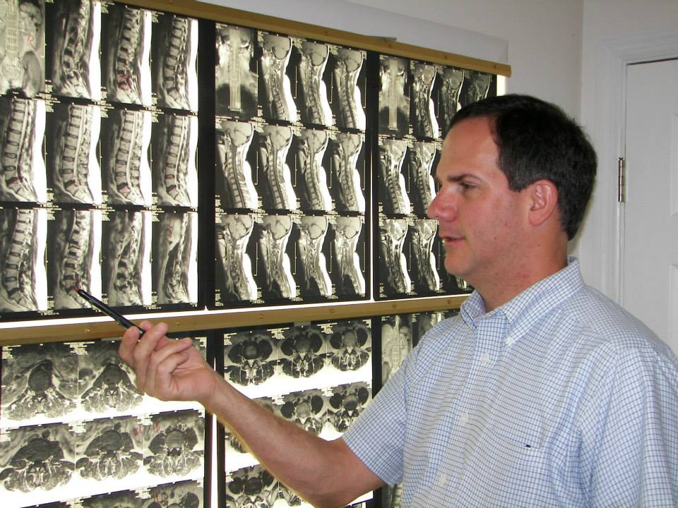 Dr. Phillips Examining Patient X-Rays